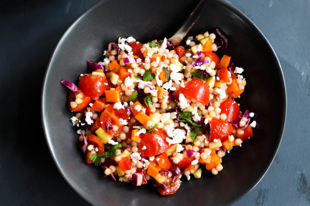 This Spicy Israeli Couscous Salad is easy to throw together and so vibrant in colors and flavors!