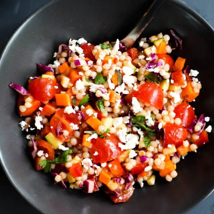 This Spicy Israeli Couscous Salad is easy to throw together and so vibrant in colors and flavors!