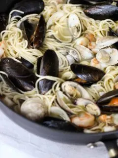 This Easy Seafood Pasta with White Wine Butter Sauce is quick enough for a week night, but still great to impress your guests!