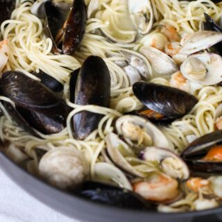 This Easy Seafood Pasta with White Wine Butter Sauce is quick enough for a week night, but still great to impress your guests!
