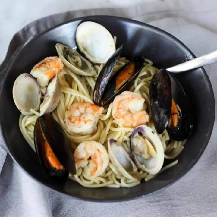 This Easy Seafood Pasta with White Wine Butter Sauce is quick enough for a week night, but still great to impress your guests!