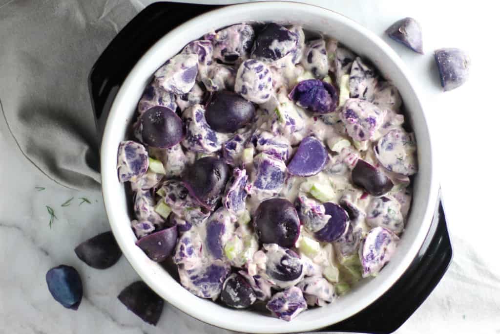 This Purple Potato Salad is an easy dish to throw together, bring to a tailgate, and show your team spirit!