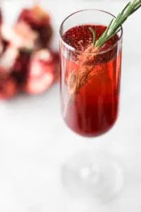 This Pomegranate Rosemary Spritzer is a fruity and earthy take on a typical toast!