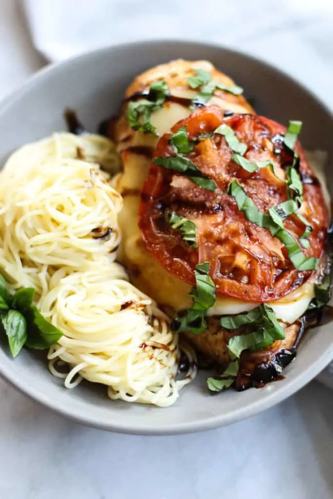 This Baked Chicken Caprese is full of bright summery flavors and is so easy to throw together!