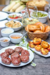 These Aussie Grass Fed Beef Burgers with Grilled Peaches and Chipotle Onion Jam will bring your next cookout to the next level with all of the layers of flavor!