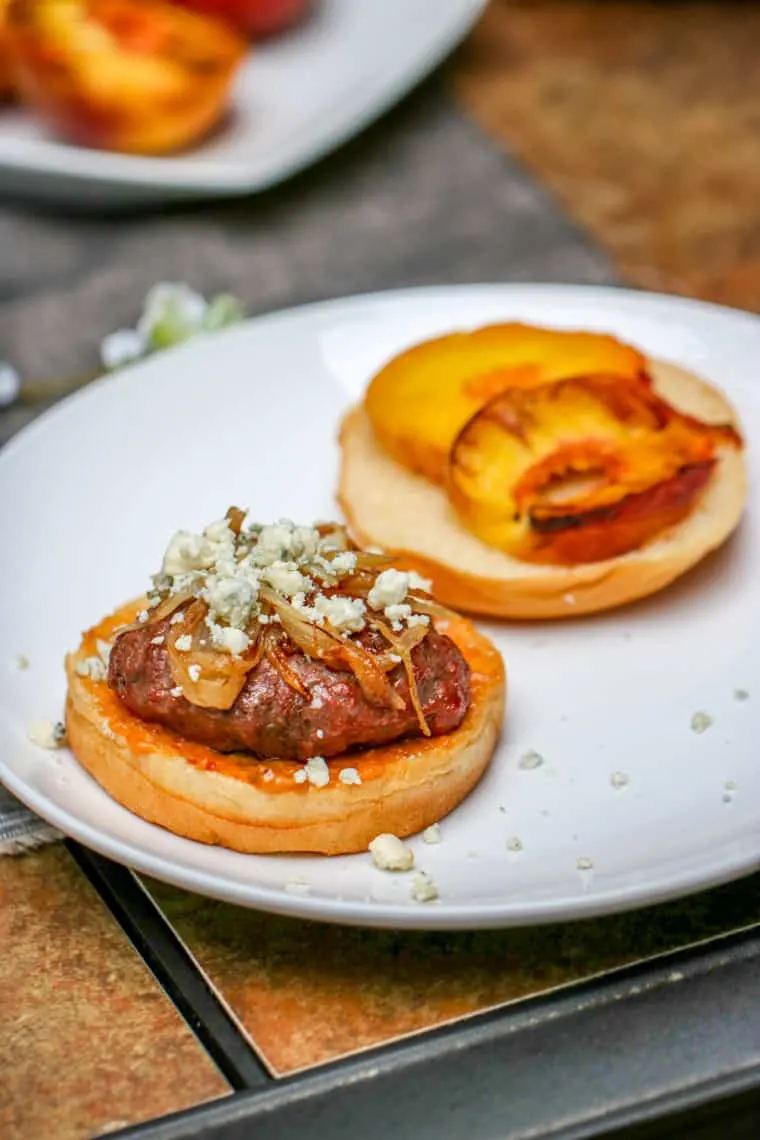 These Aussie Grass Fed Beef Burgers with Grilled Peaches and Chipotle Onion Jam are layered with bold flavors and perfect for the adventurous eater!