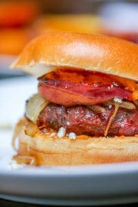 These Aussie Grass Fed Beef Burgers with Grilled Peaches and Chipotle Onion Jam are layered with bold flavors and perfect for the adventurous eater!