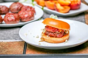 These Aussie Grass Fed Beef Burgers with Grilled Peaches and Chipotle Onion Jam are layered with bold flavors and perfect for the adventurous eater!