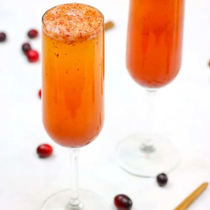 These Spiced Cranberry Cider Mimosas are perfect for your holiday festivities!