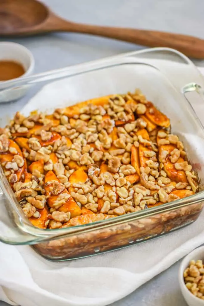 a closeup of walnuts and apples on the cake