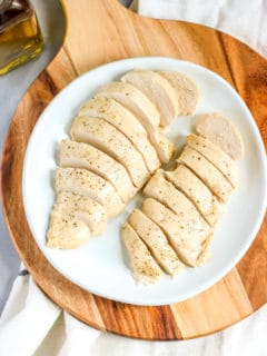 two sliced and cooked chicken breasts