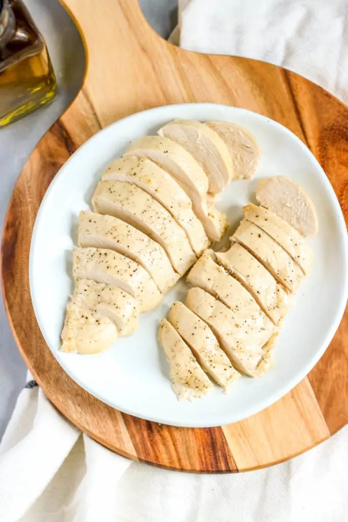 two sliced and cooked chicken breasts