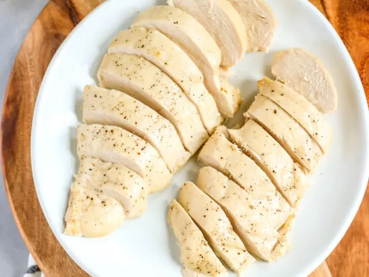 two sliced and cooked chicken breasts