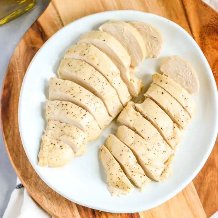 two sliced and cooked chicken breasts