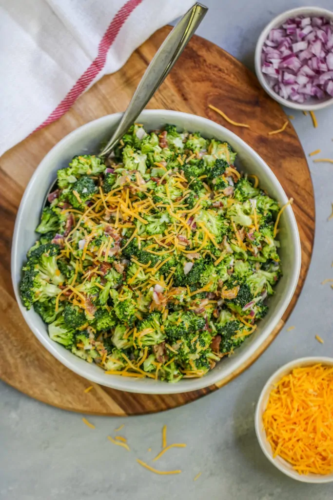 This easy Broccoli Salad with Bacon will become a classic for all of your potlucks and tailgates with just a few ingredients needed to bring it together.