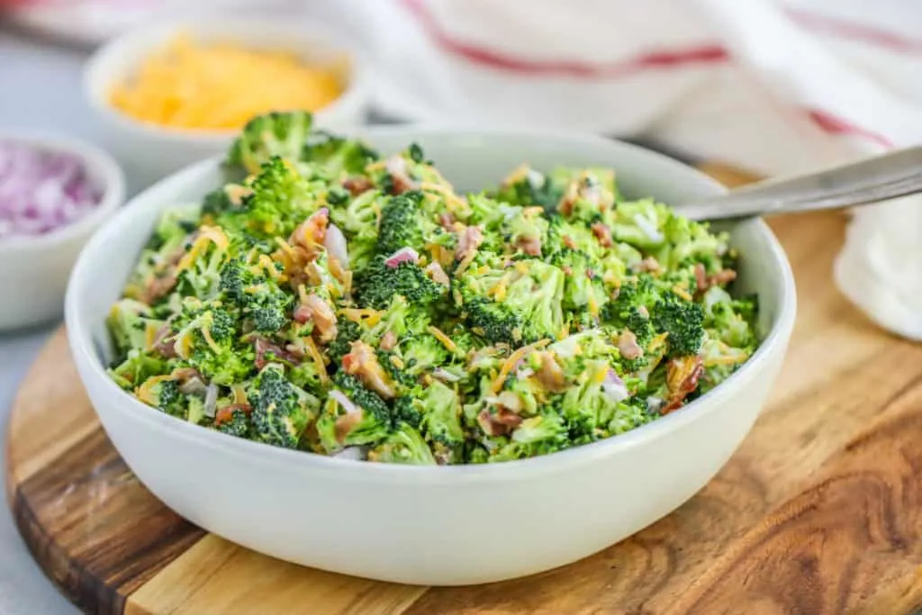 This easy Broccoli Salad with Bacon will become a classic for all of your potlucks and tailgates with just a few ingredients needed to bring it together.