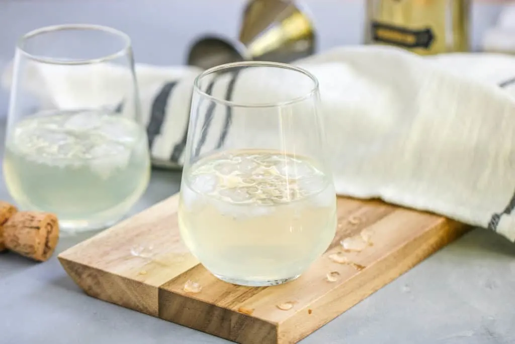 This Sparkling Elderflower Lemonade will quickly become your favorite drink of summer! It’s an adult floral lemonade topped with champagne. What’s not to love?