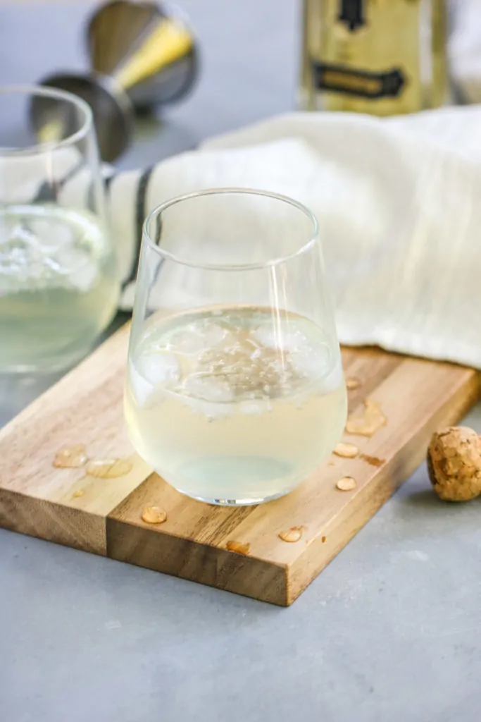 This Sparkling Elderflower Lemonade will quickly become your favorite drink of summer! It’s an adult floral lemonade topped with champagne. What’s not to love?