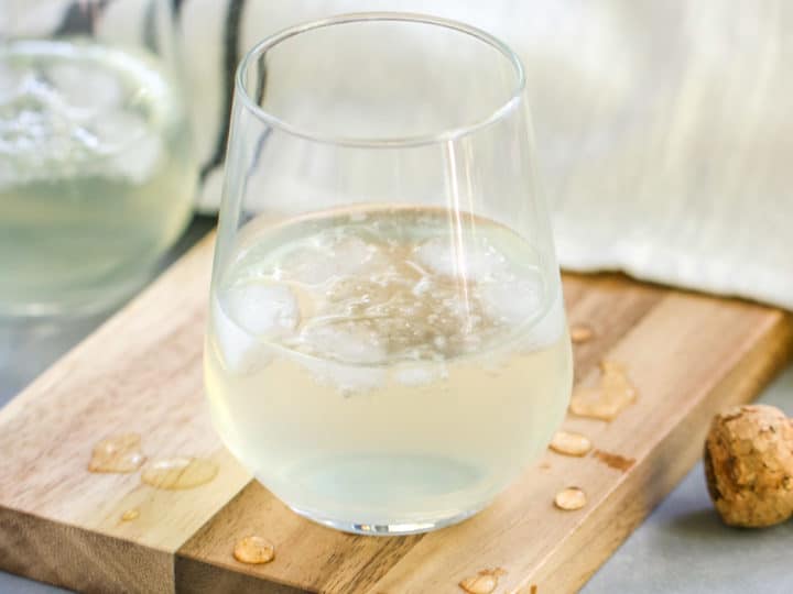 This Sparkling Elderflower Lemonade will quickly become your favorite drink of summer! It’s an adult floral lemonade topped with champagne. What’s not to love?