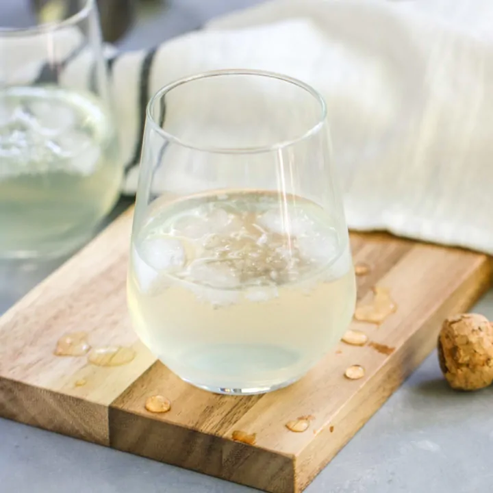 This Sparkling Elderflower Lemonade will quickly become your favorite drink of summer! It’s an adult floral lemonade topped with champagne. What’s not to love?