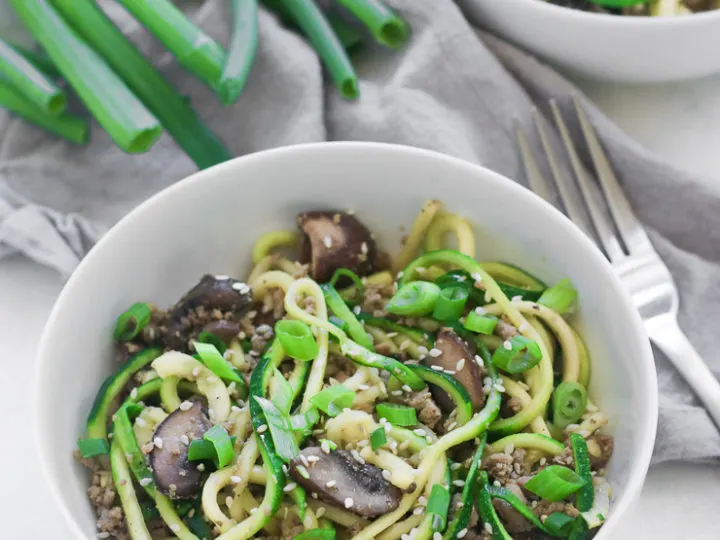 two bowls of sesame zoodles with ground turkey