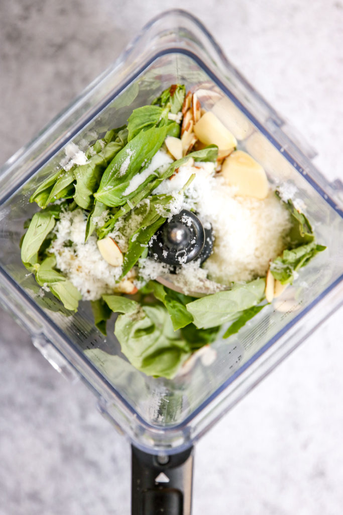 basil, parmesan, garlic, and almond in a blender