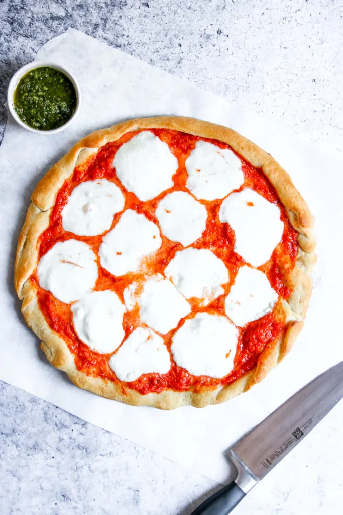 melted mozzarella on a tie dye pizza