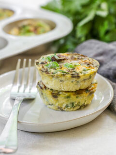 a close up of two veggie egg muffins