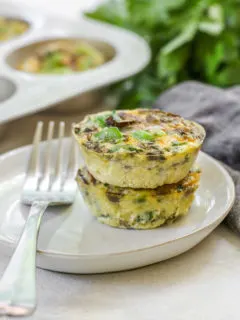 a close up of two veggie egg muffins