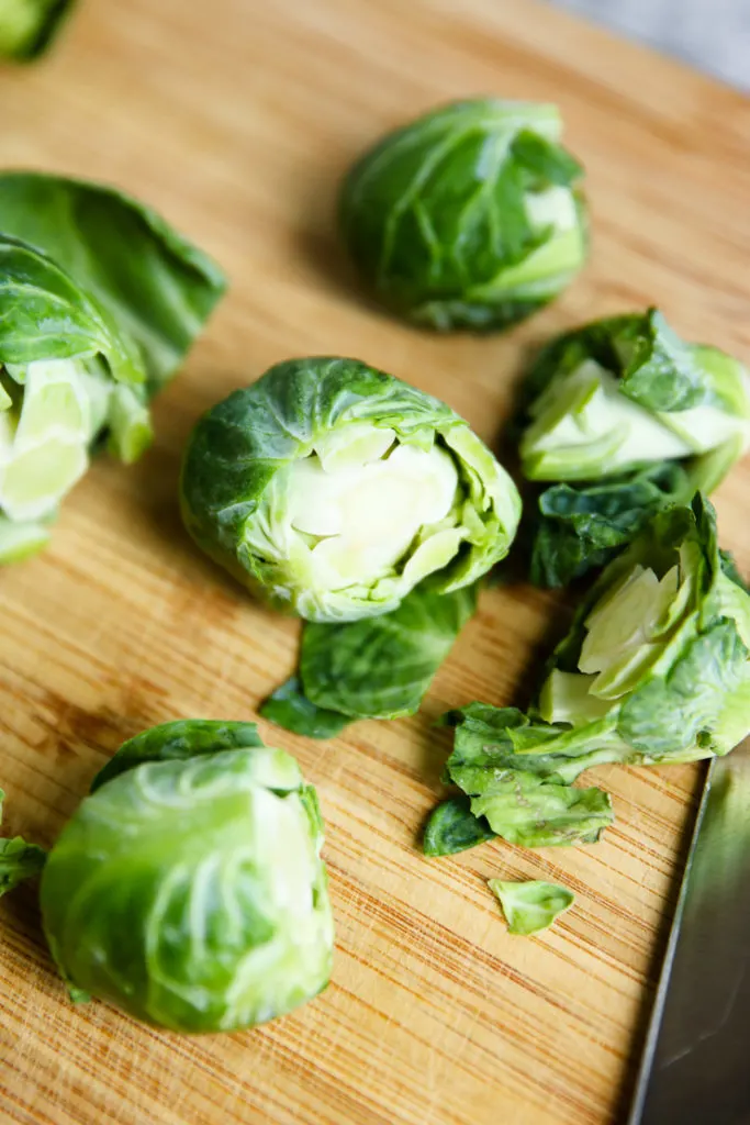 Closeup of Brussels Sprouts on a wooden cutting board