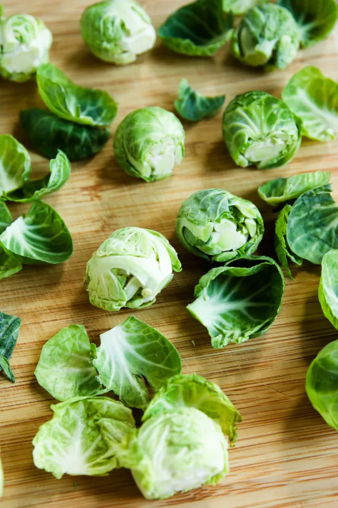 Brussels Sprouts on a wooden cutting board