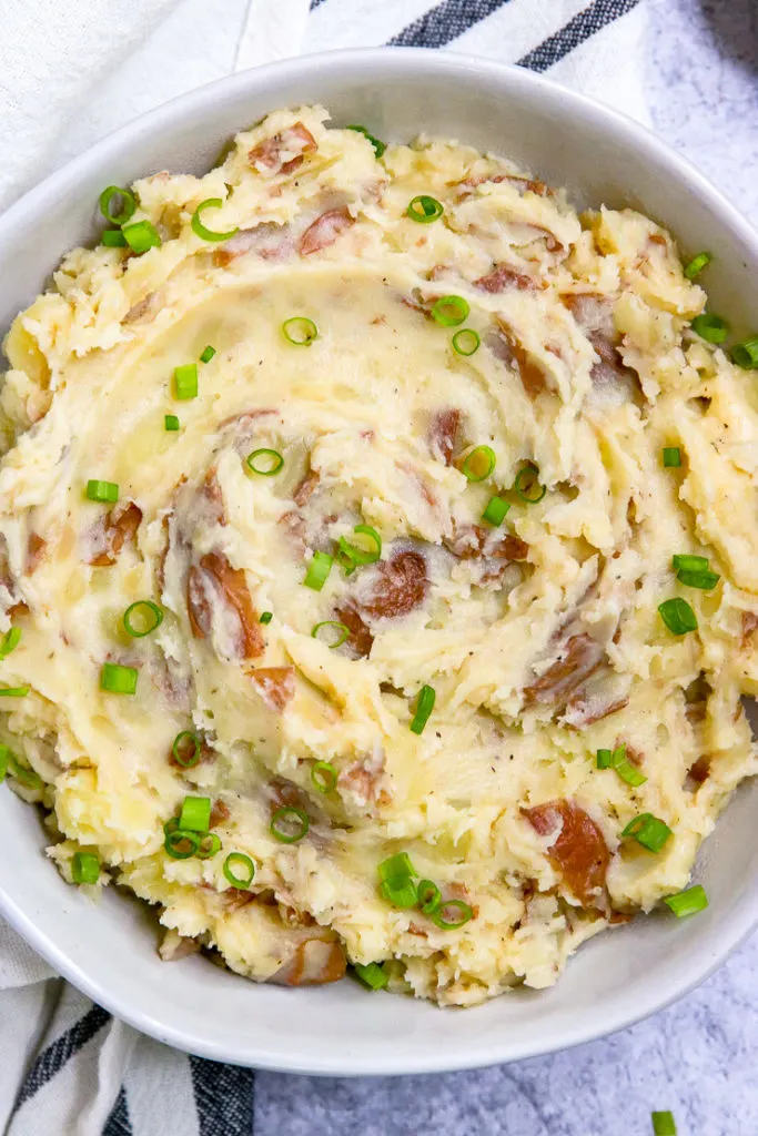 red skin mashed potatoes with diced green onions sprinkled on top