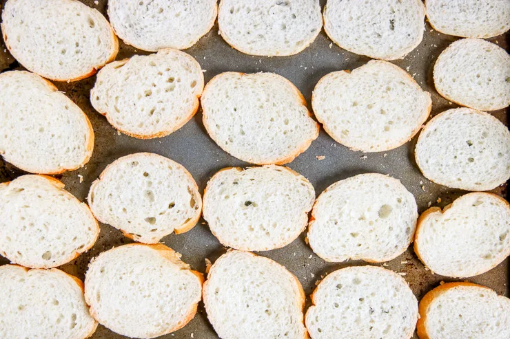 four rows of sliced bread on a cookie sheet