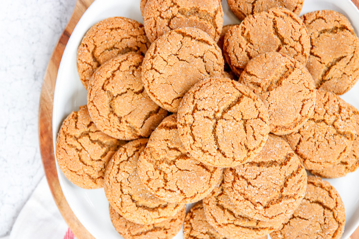 a plate of ginger snaps piled on top of one another