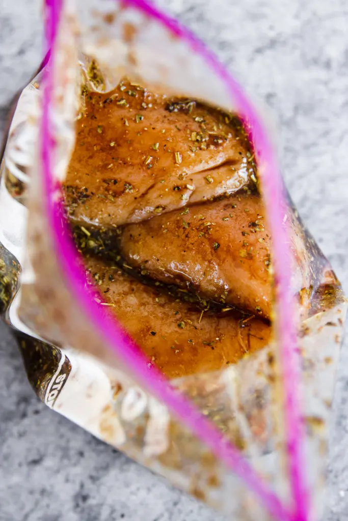 a ziplock of chicken breasts and balsamic marinade