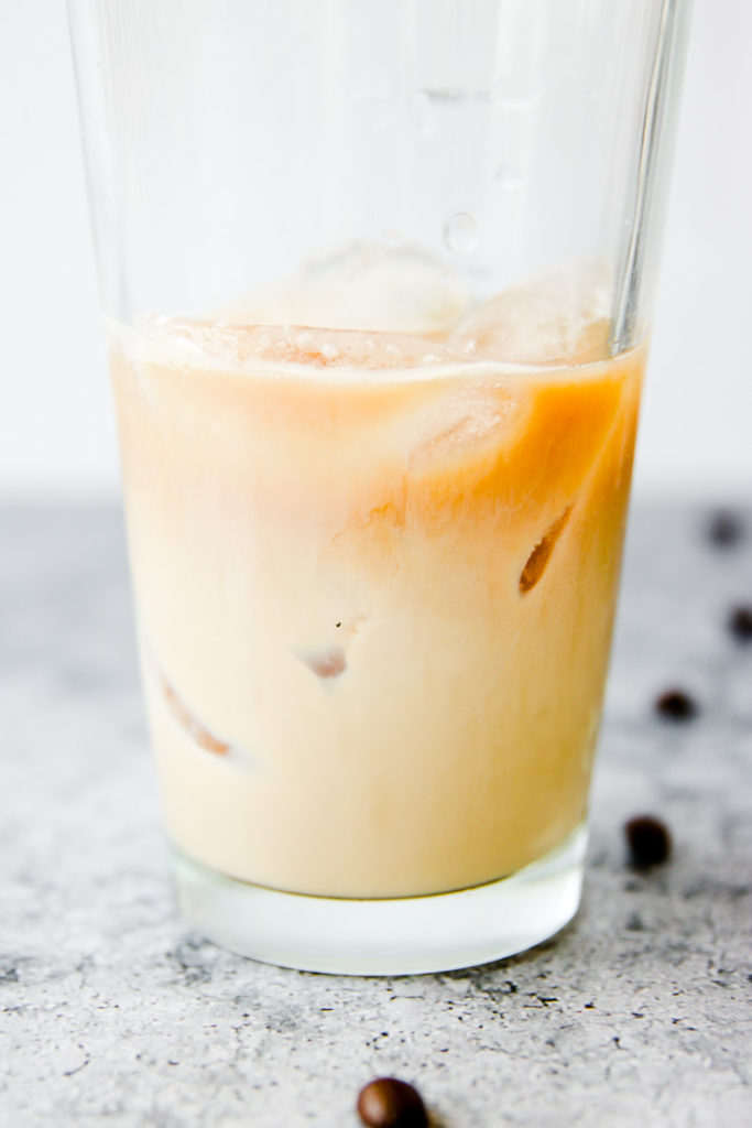 a glass with ice and espresso, baileys, and vodka