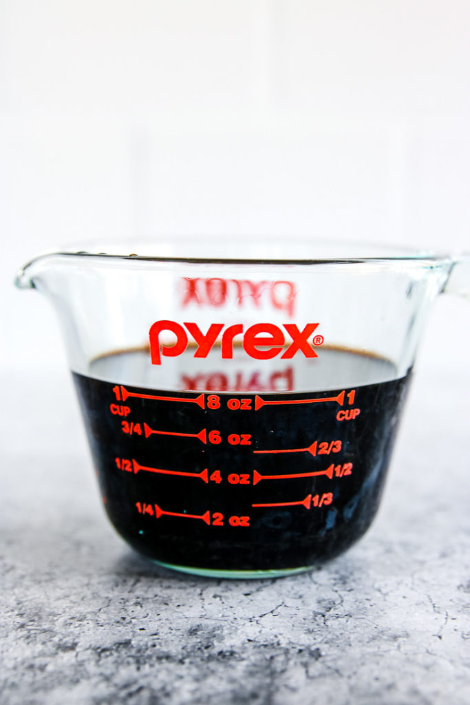 a pyrex measuring cup full of balsamic vinegar