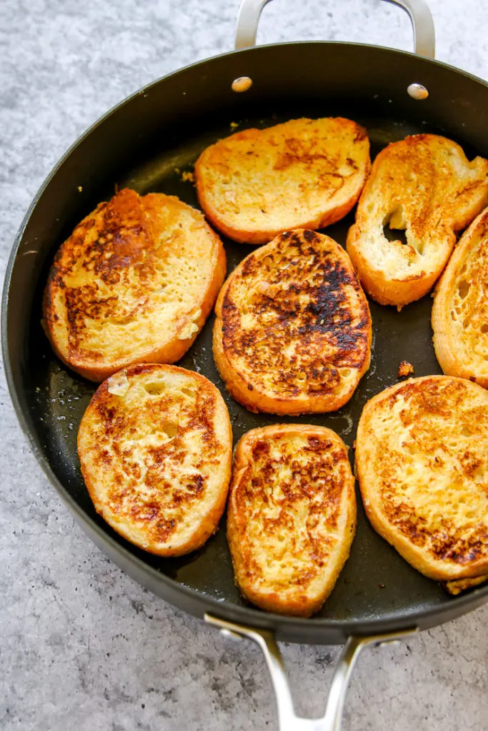 a skillet of browned french toast slices