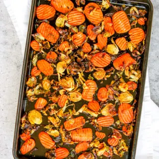 a sheet pan full of roasted brussels sprouts and carrots