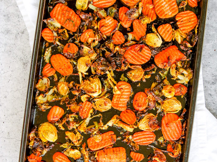 a sheet pan full of roasted brussels sprouts and carrots