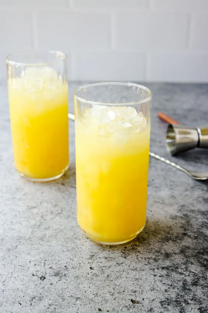 two screwdriver cocktails in highball glasses