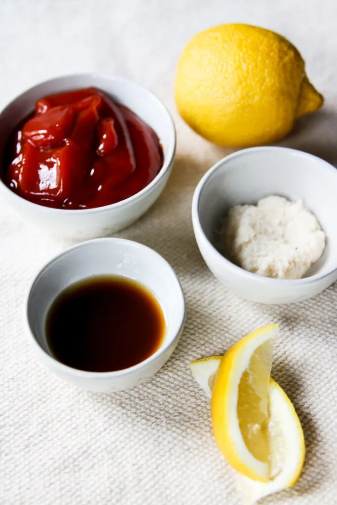 bowls of ketchup, prepared horseradish, Worcestershire sauce, and lemon juice
