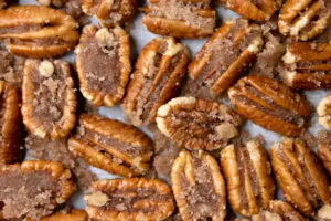 a close up of candied pecan halves