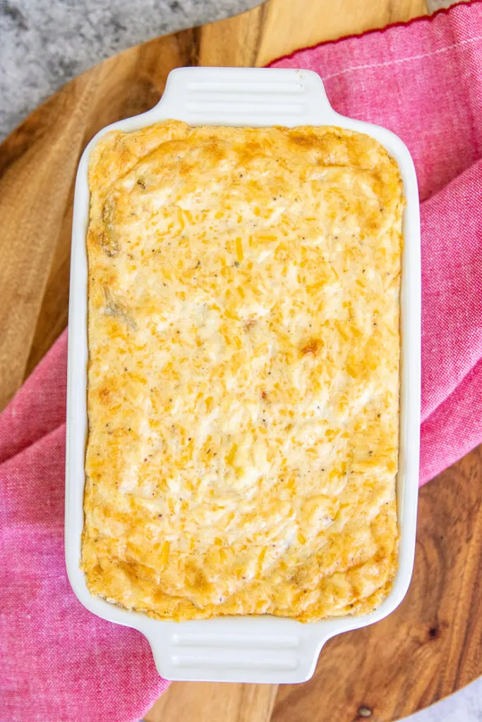 a small white baking dish with baked crab dip