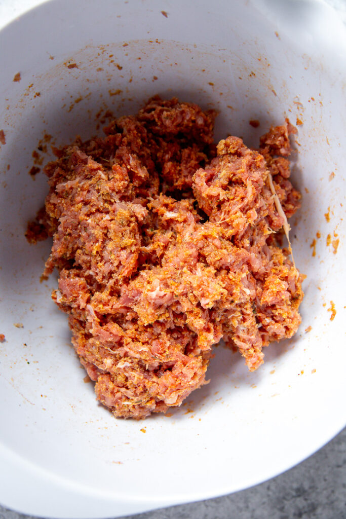 a bowl of ground turkey and seasonings