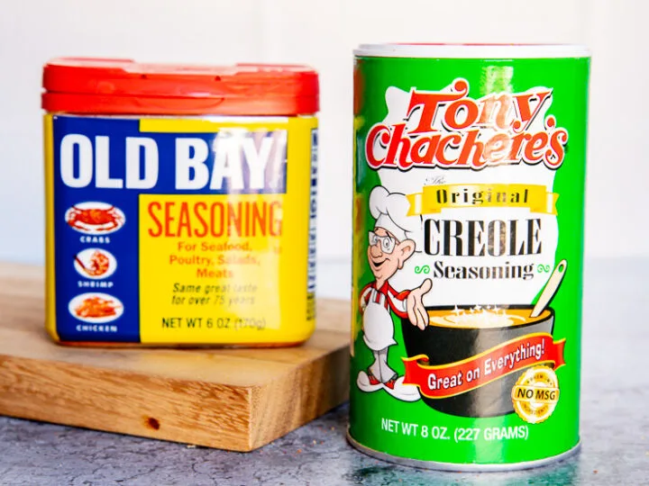 a container of old bay and tony chachere's creole seasoning