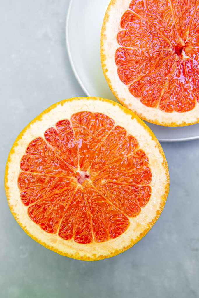 two halves of a grapefruit facing towards the camera