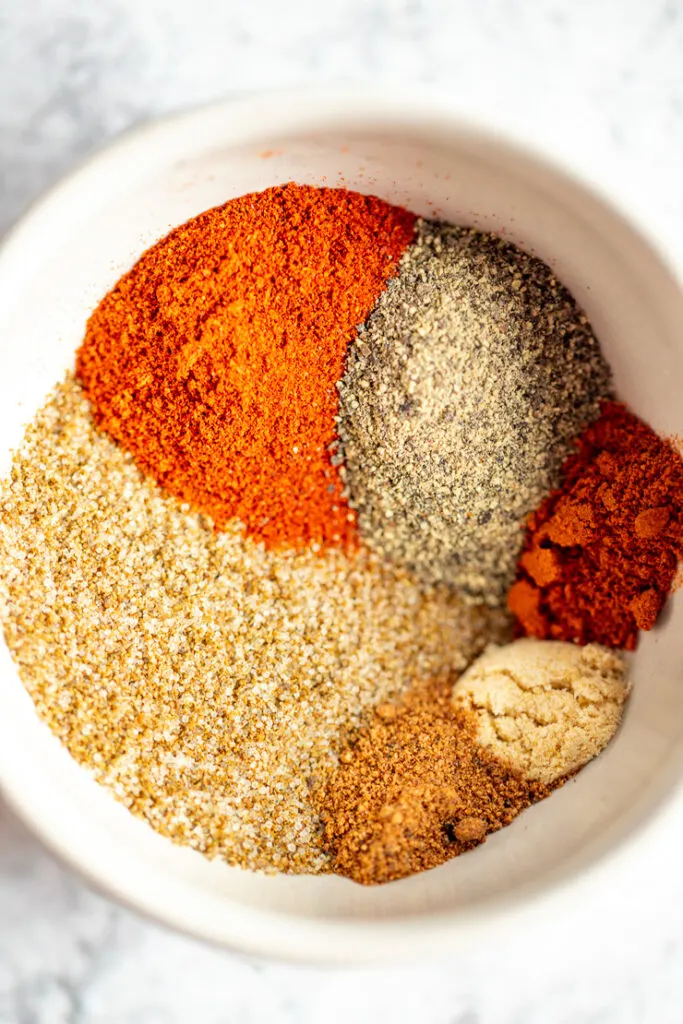 A bowl of all of the spices before they are mixd together.