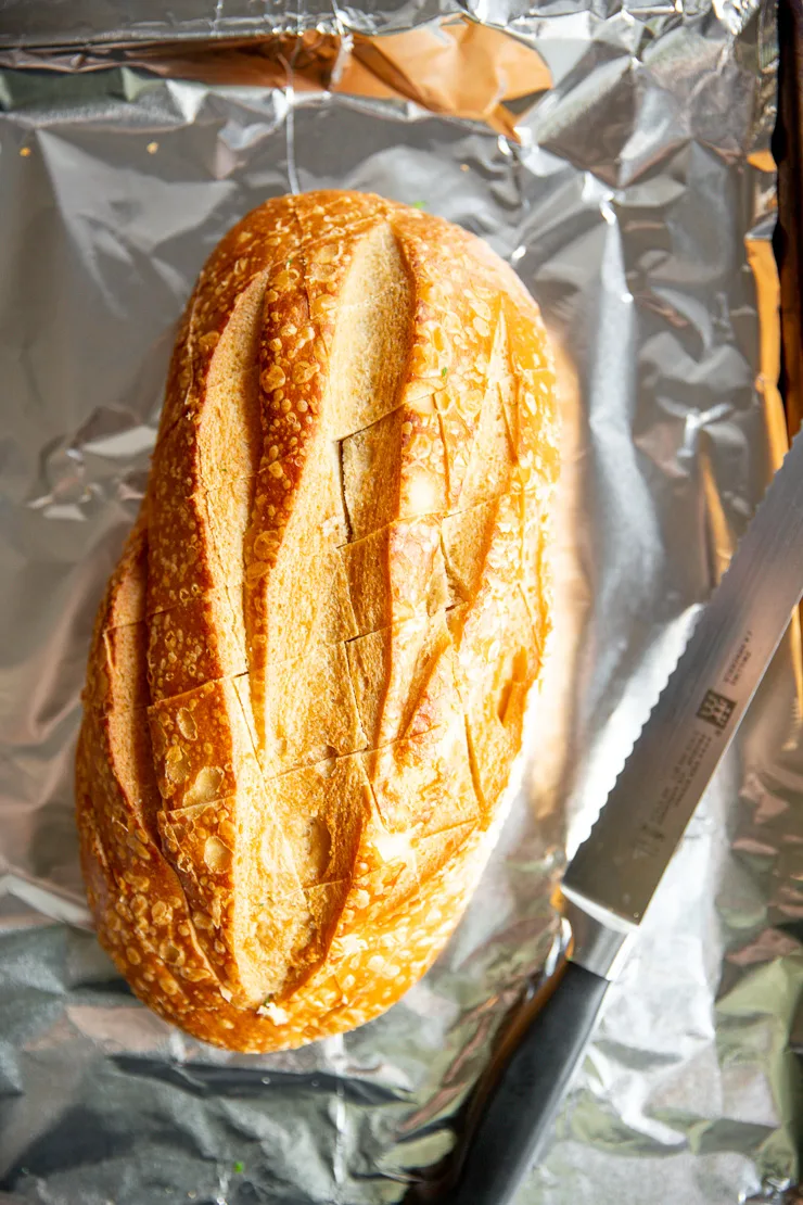 a loaf of sourdough bread cut diagonally