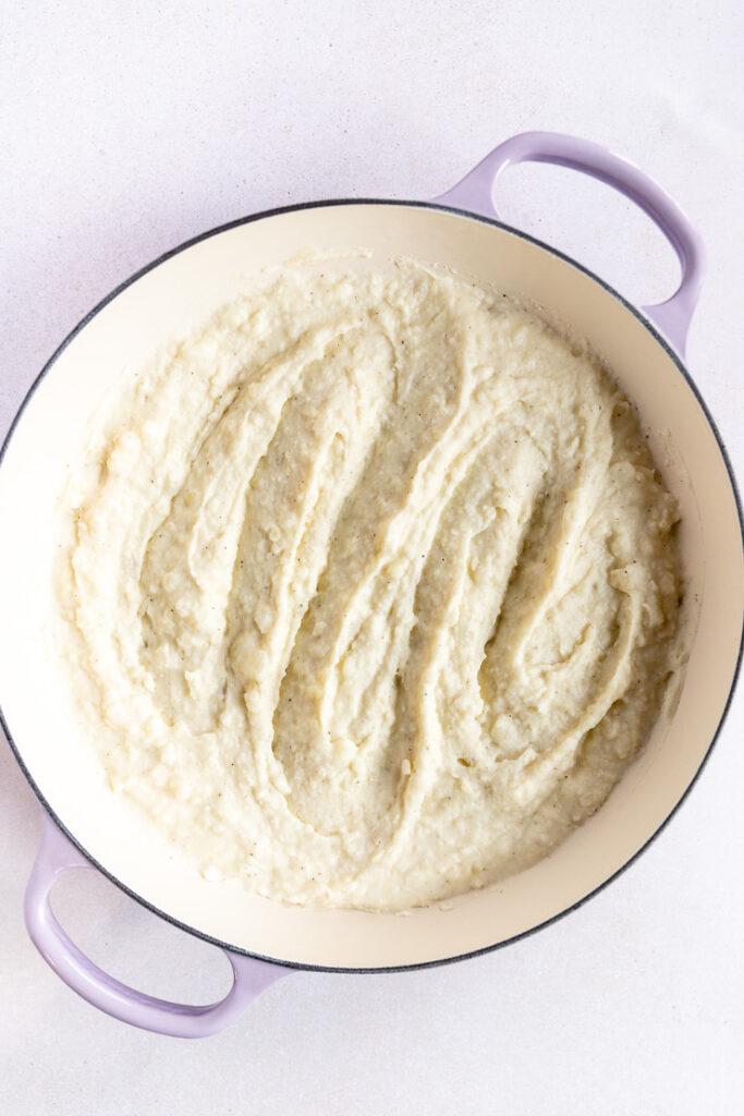 A lavender braiser filled with swirled horseradish mashed potatoes.